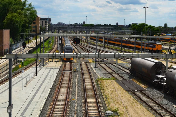 stock image Railway lines and modern trains on sunny day