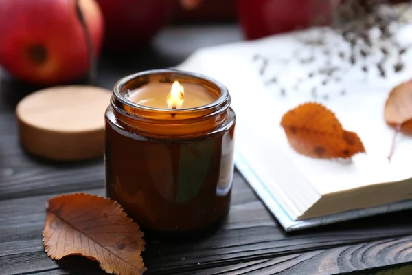 Beautiful Burning Candle Book Wooden Table Closeup Autumn Atmosphere — Stock Photo, Image