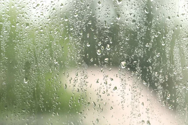 以雨滴为背景的玻璃窗 — 图库照片