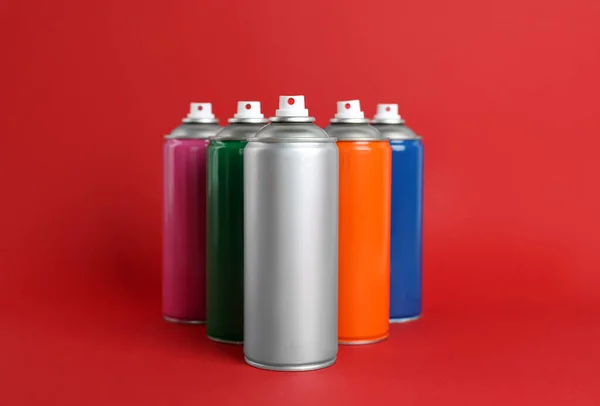 Colorful Cans Spray Paints Red Background — Stock Photo, Image