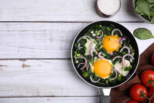 stock image Flat lay composition with tasty Shakshouka and ingredients on white wooden table. Space for text