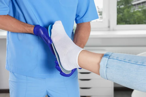 Male Orthopedist Fitting Insole Patient Foot Hospital Closeup — Stock Photo, Image