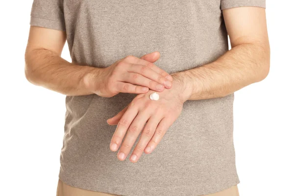 Man Applying Cream Hand White Background Closeup — Foto Stock