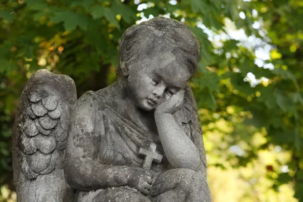 Stock image Beautiful statue of angel at cemetery on sunny day, space for text. Funeral ceremony