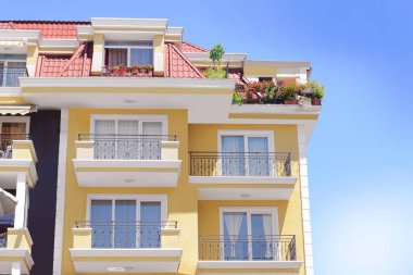 Exterior of beautiful residential building against blue sky