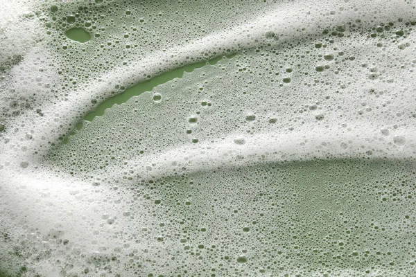 オリーブの背景に白い泡 トップビュー — ストック写真