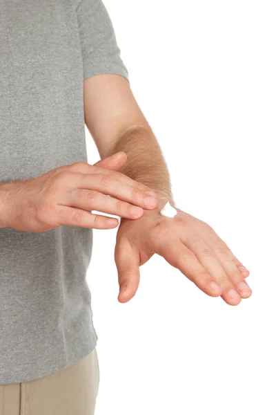 Man Applying Cream Hand White Background Closeup — Zdjęcie stockowe