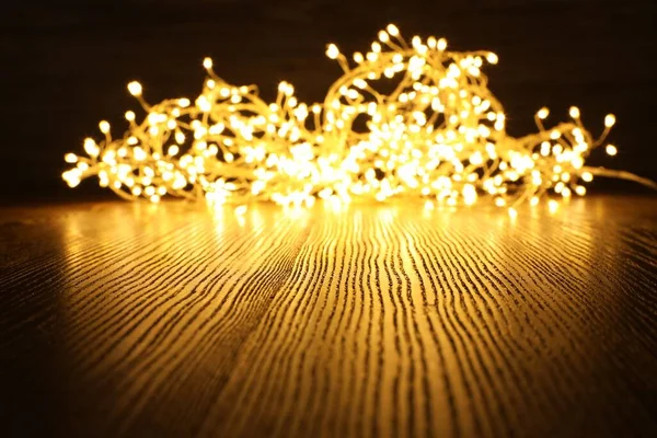 Beautiful Glowing Christmas Lights Wooden Table Space Text — Stock Photo, Image
