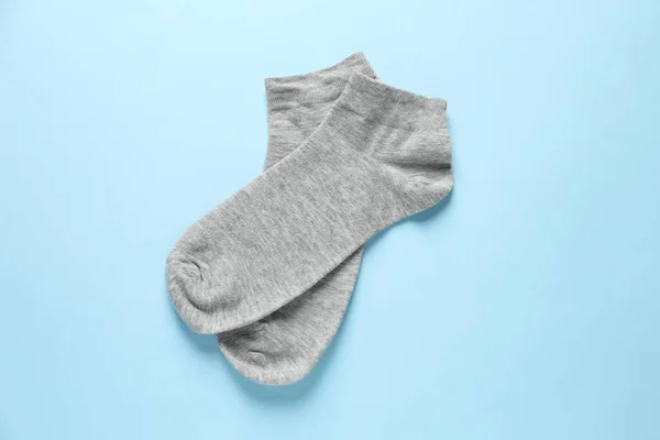 Pair Grey Socks Light Blue Background Flat Lay — Stock Photo, Image