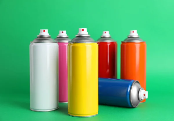 Colorful Cans Spray Paints Green Background — Stock Photo, Image