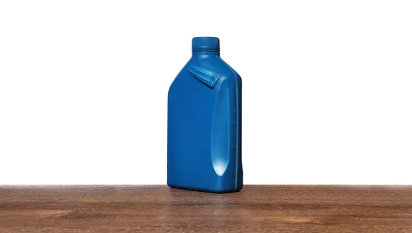 Motoröl Blauen Container Auf Holztisch Vor Weißem Hintergrund — Stockfoto