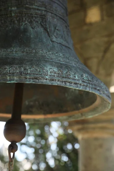Closeup view of large old bell in tower