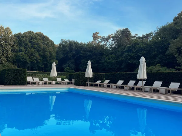 stock image Outdoor swimming pool in luxury hotel on sunny summer day. Time for relax