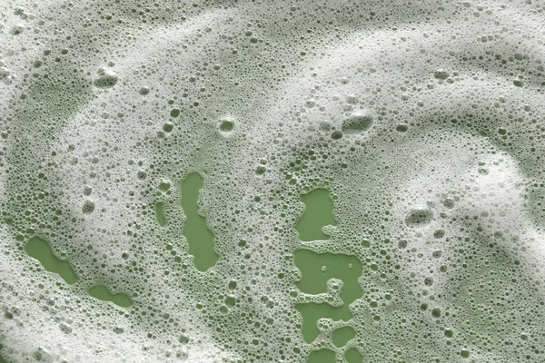 オリーブの背景に白い泡 トップビュー — ストック写真