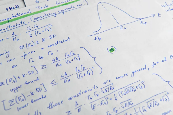 Paper with written mathematical calculations as background, closeup