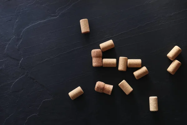 stock image Wine bottle corks on black table, flat lay. Space for text