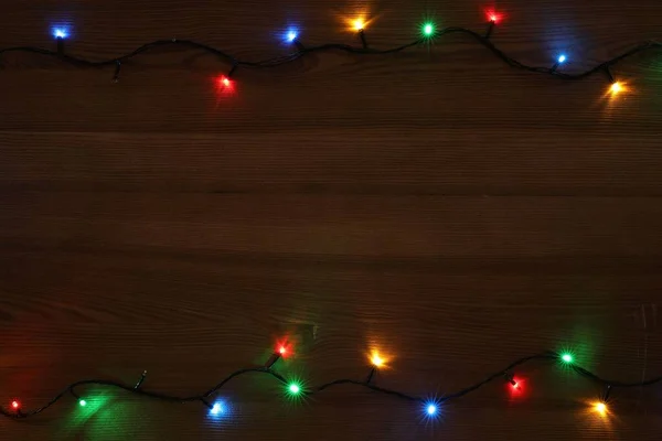 Quadro Luzes Natal Coloridas Mesa Madeira Vista Superior Espaço Para — Fotografia de Stock