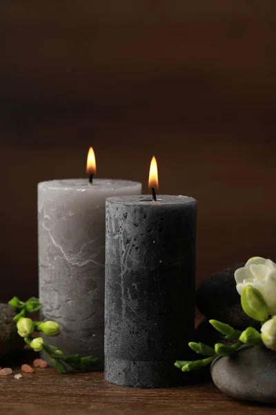 Beautiful Composition Burning Candles Spa Stones Flowers Wooden Table — Stock Photo, Image