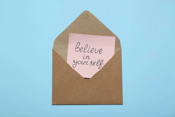 Envelope Message Believe Yourself Light Blue Background Top View Motivational — Stock Photo, Image