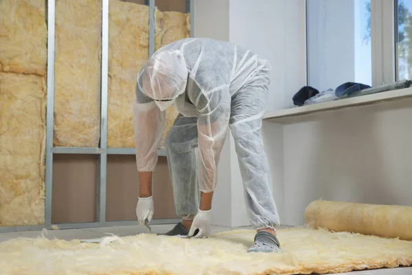 Worker Measuring Cutting Insulation Material Indoors — Fotografia de Stock