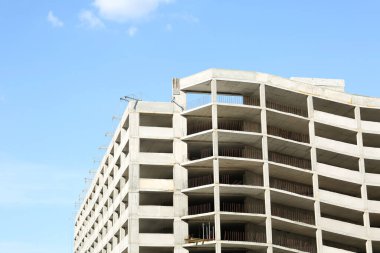 Construction site with unfinished building on sunny day