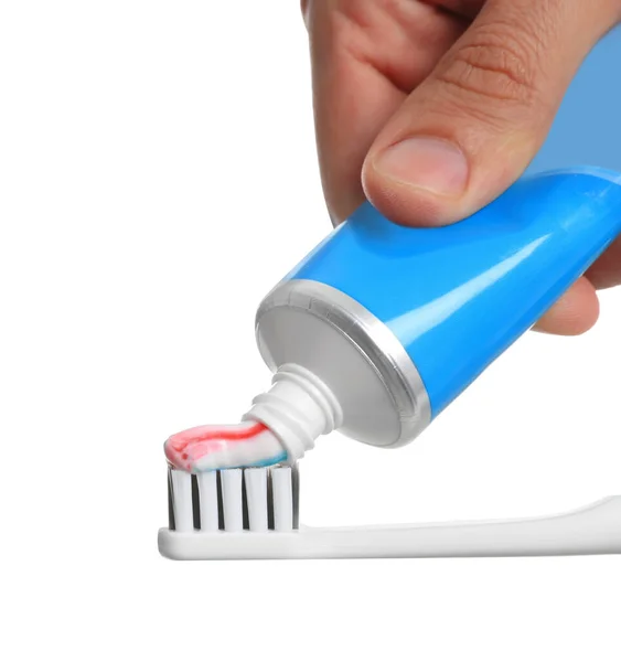 Man Applying Toothpaste Brush White Background Closeup —  Fotos de Stock