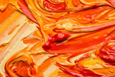 Beautiful strokes of colorful oil paints as background, closeup