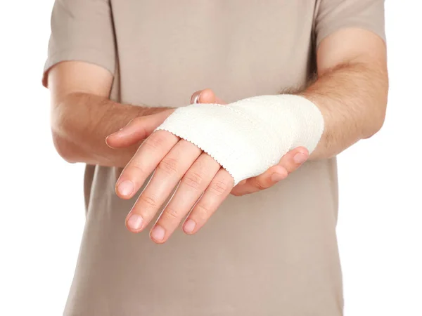 Man Med Handen Insvept Medicinskt Bandage Vit Bakgrund Närbild — Stockfoto