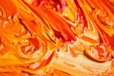 Beautiful strokes of colorful oil paints as background, closeup