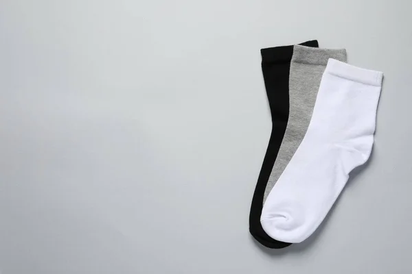 Different Socks Light Grey Background Flat Lay Space Text — Stock Photo, Image