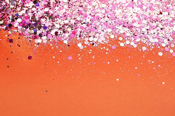 stock image Shiny bright pink glitter on coral background. Space for text