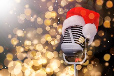 Retro microphone with Santa hat against blurred lights, space for text. Christmas music. Bokeh effect clipart