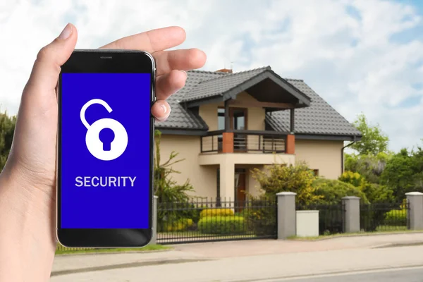 Home Security System Woman Smartphone Her House Outdoors Closeup — Stock Photo, Image