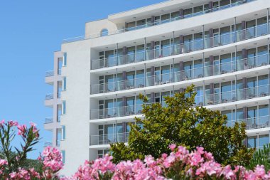 Exterior of beautiful residential building against blue sky