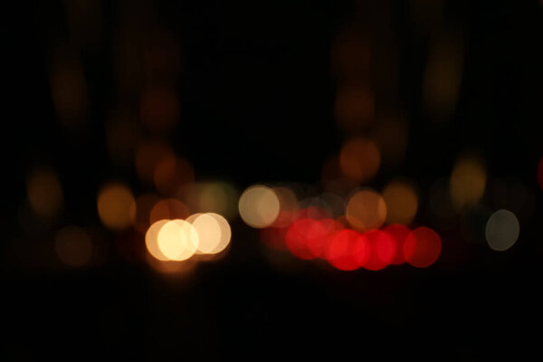 Blurred view of city lights at night. Bokeh effect