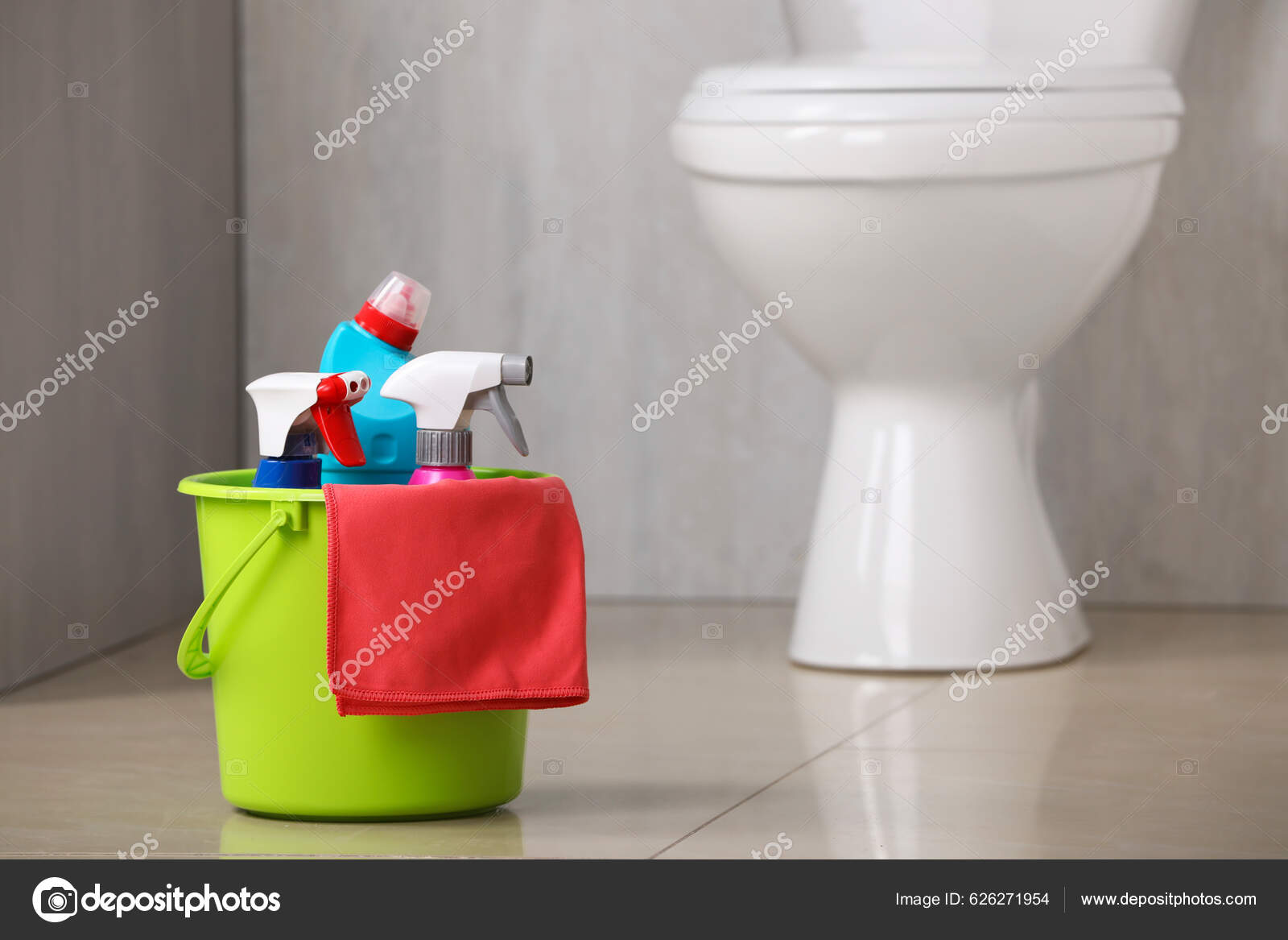 Cleaning supplies and toilet bowl in bathroom. Space for text