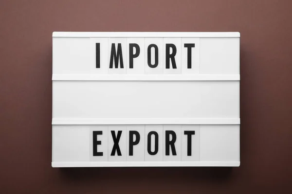 Lightbox Com Palavras Importar Exportar Fundo Marrom Vista Superior — Fotografia de Stock