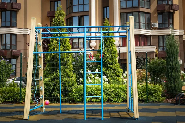 Empty monkey bars on outdoor children\'s playground in residential area