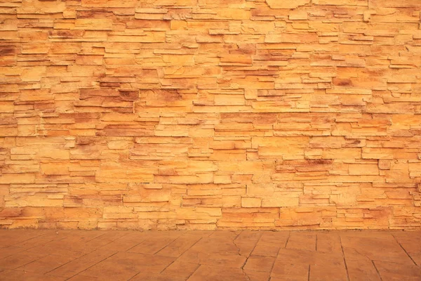 Beautiful textured stone wall and sidewalk outdoors