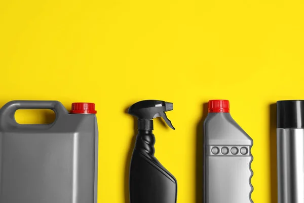 Different car products on yellow background, flat lay. Space for text