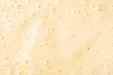 Arkaplan olarak köpüklü lezzetli smoothie, yakın plan