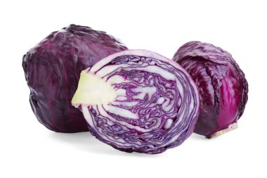Whole and cut red cabbages on white background