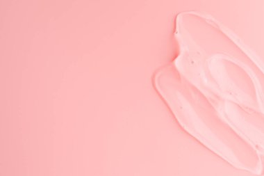 Pembe arka planda şeffaf jel örneği, üst manzara. Metin için boşluk