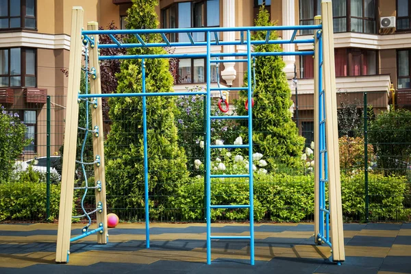 Empty monkey bars on outdoor children\'s playground in residential area