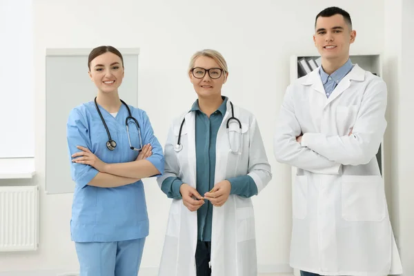 Portrait of medical doctors wearing uniforms in clinic