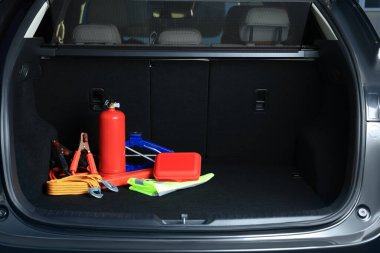 Set of car safety equipment in trunk, space for text clipart