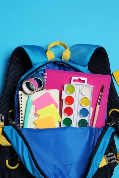 Backpack School Stationery Light Blue Background Top View — 스톡 사진