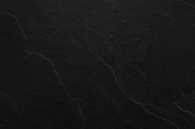 Arkaplan olarak siyah taş yüzeyinin dokusu, yakın plan