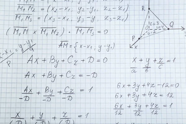 Sheet of paper with different mathematical formulas, top view