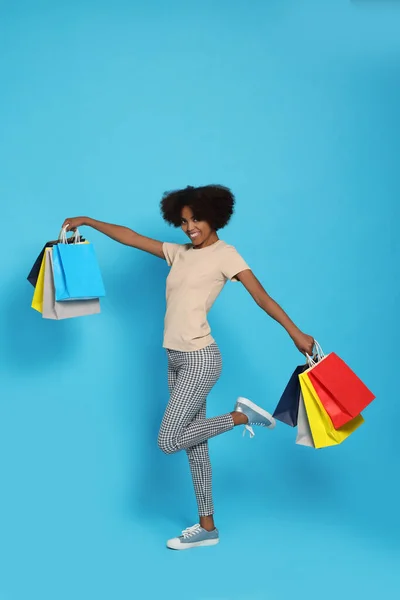 Happy African American Woman Shopping Bags Light Blue Background — Foto Stock
